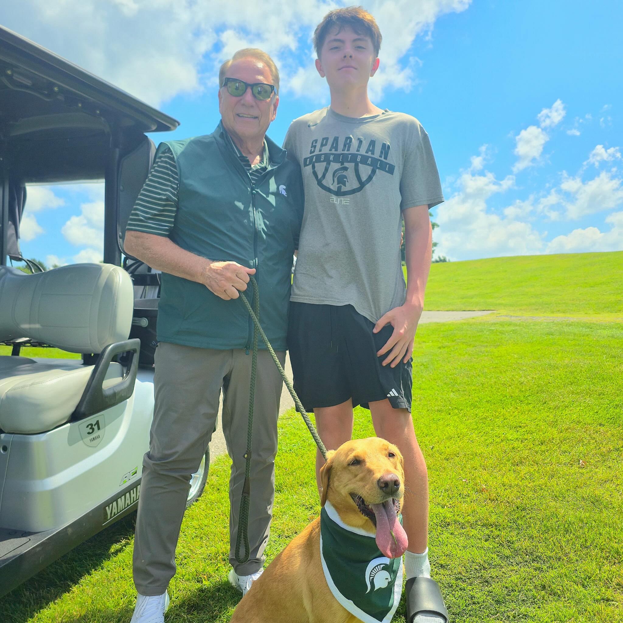Zeke with fans at a golf course